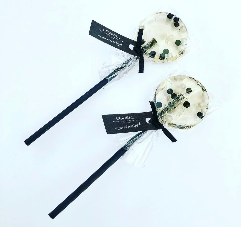 Black and white sprinkle lollipops